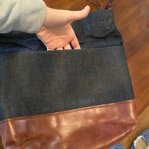 R Riveter large bag . Dark denim , leather bottom and straps . Used condition .